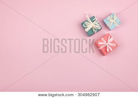 Mother Day, Festive, Birthday, Gift Pastel Minimal Background. Multicolored Gift Boxes On Pink Backg