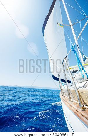 Sailing. Ship Yachts With White Sails In The Open Sea.