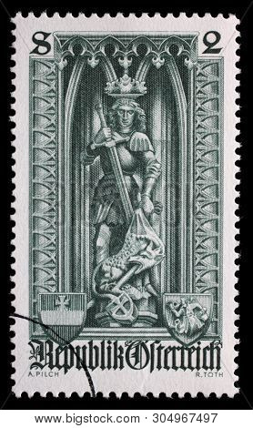 AUSTRIA - CIRCA 1969: A stamp printed in the Austria dedicated to 500th anniversary of Diocese of Vienna, shows the statue of St. George and the Dragon in St. Stephens Cathedral, Vienna, circa 1969