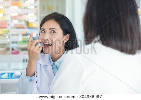 Doctor Test And Teach Spray And Checking For A Patient's Mouth