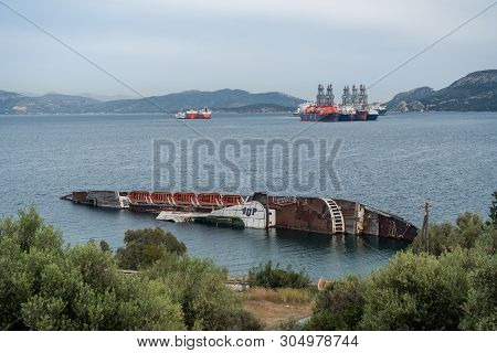 Piraeus, Greece - 15 May 2019: Capsized Cruise Liner In The Ocean Near Piraeus, Greece