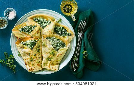 Traditional Italian Pancakes Crepes With Spinach And Ricotta On A Served Blue Table. Healthy Vegetar