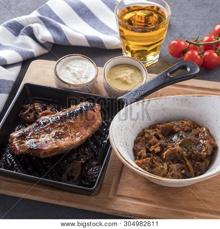 Bigas With Brisket On An Edge On A Wooden Board