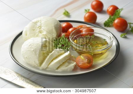 Mozzarella Cheese And Cherry Tomatoes With Spices. Homemade Mozzarella Cheese, Isolated.
