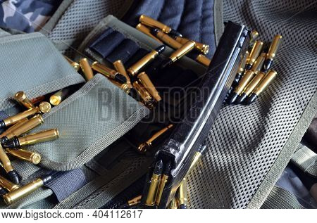 Ammunition 7,62*39.Tactical unloading vest as background. October 23, 2020.Kiev,Ukraine