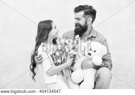 One Adoption Is Enough To Change Lives. Adoptive Family. Bearded Man And Little Girl Hold Flowers An
