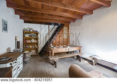 Cassagna, Genoa, Italy - October 2020: Old-fashioned Sitting Room With Vintage Wooden Furniture In O