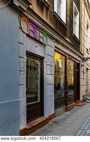 Poznan, Poland - February 15 2020 Facade Of Pub Near Market Square With Colorful Neon Sign 