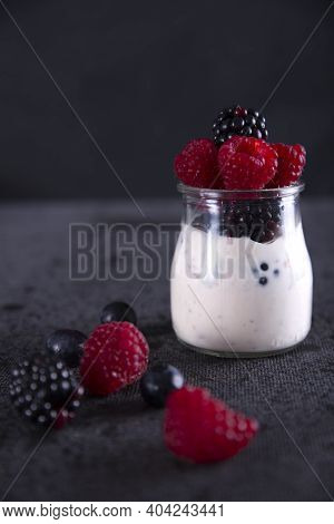 Healthy Diet With Red Fruits Such As Blackberries, Blueberries, Raspberries And Yogurt.