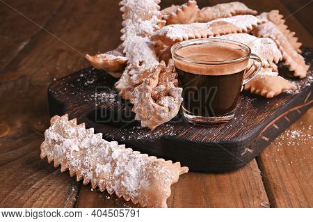 Carnival Food Typical And Italian Espresso. Sfrappole Or Chiachiere Or Angel Wings And Aromatic Coff