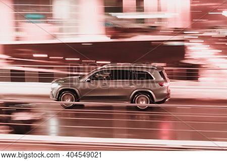 Moscow, Russia - January 22, 2021: Fast Moving Silver Suv Car With Motion Blur Effect. Overspeed Con