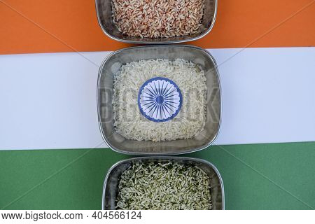 Three Colors Of Rice Resembling Indian Tri Colored India Flag With Ashok Chakra. Background To Write