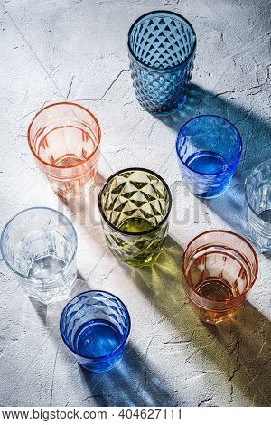 Colorful Faceted And Geometric Drink Glass, Group Of Empty Green, Red, Blue And Transparent Drinkwar
