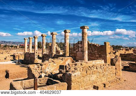 Ancient Ruins Of Kourion City Near Pathos And Limassol, Cyprus. Row Of Columns Under Blue Sky. Trave