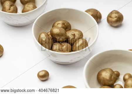 White Ceramic Bowl Full Of Chocolate Pralines. Sweet Truffles With Cinamon, Cardamom And Clove On A 