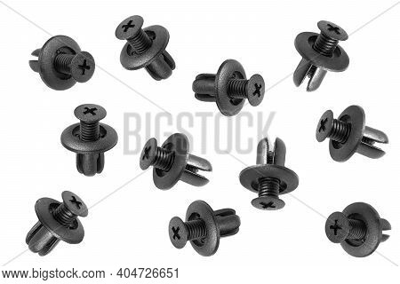 Macro Shot Plastic Black Clips For The Car. Panel Plastic Rivets Isolated On A White Background. Aut
