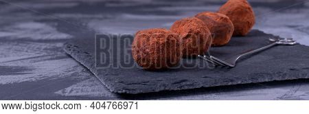 Chocolate Truffles With Cocoa Powder On The Stone Plate. French Cuisine Dessert. Wide Banner