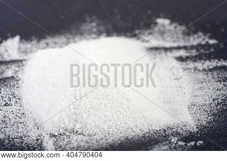 Makrogol Powder Photographed Against A Black Background In The Studio
