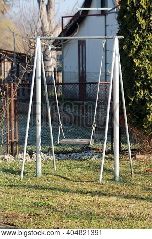Grey Dilapidated Homemade Outdoor Playground Equipment Metal Swing Built In Family House Backyard Su