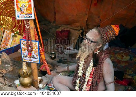 Kolkata, West Bengal, India - 12th January 2020 : Hindu Sadhu Dressed In Garland, Safron And White A