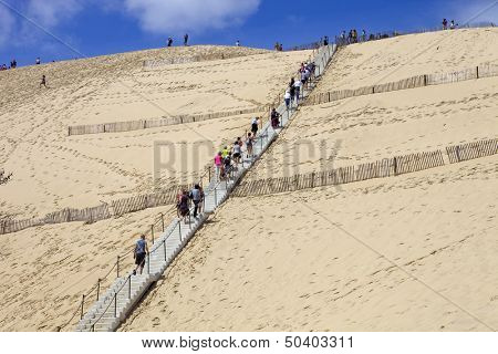 PYLA SUR MER, FRANCE - AUGUST 8: People visiting the Famous dune of Pyla, the highest sand dune in Europe, on August 8, 2012 in Pyla Sur Mer, France.