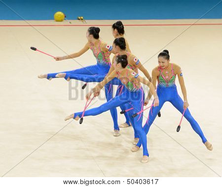 KIEV, UKRAINE - SEPTEMBER 1: Team Japan performs the routing with clubs during the 32nd Rhythmic Gymnastics World Championships in Kiev, Ukraine on September 1, 2013