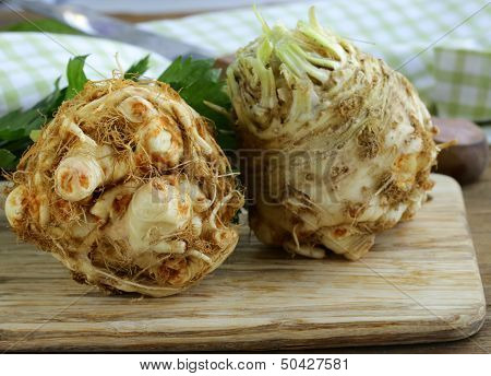 fresh organic celery root with green leaves