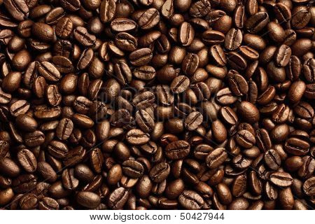 Roasted brown coffee beans, can be used as a background and texture