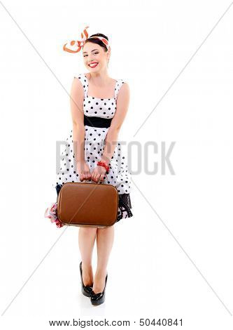 Pinup girl with suitcase in dress spotted, full length retro portrait of young happy sexy woman in pin-up style, vintage stylization over white