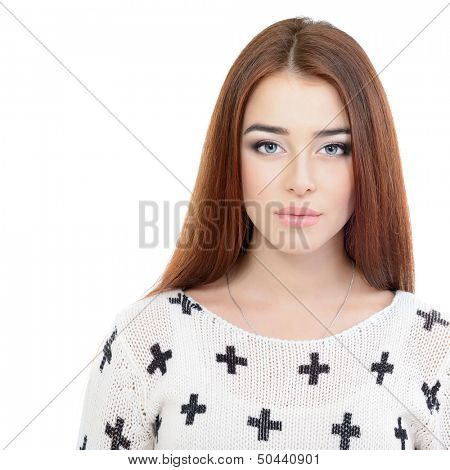 Portrait of beautiful red-haired young woman lookingat camera, over white