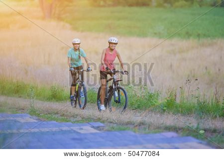 Portrait Of Two Nice Sportswomen Having Journey Outside