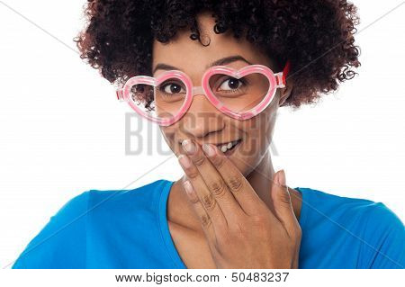 Young Model In Heart Shaped Frame Stifling Her Giggle