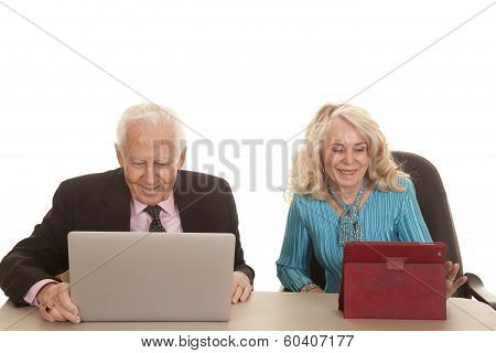 Elderly Couple Business Computers Look Down