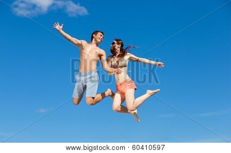 Portrait of a happy young couple enjoying at beach