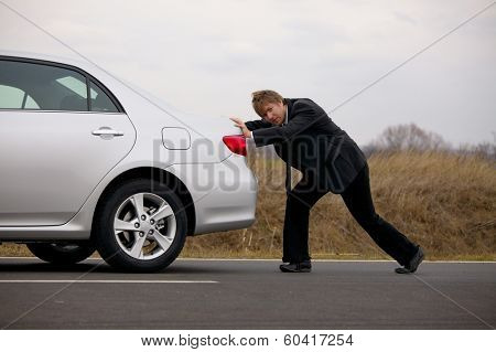 Pushing a broken down car