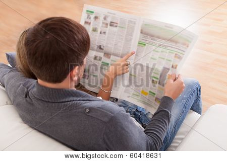 Both Read Article From Newspaper