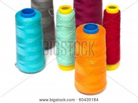 colorful bobbins isolated