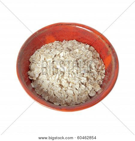 Oatmeal in a ceramic bowl isolated over white