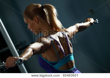Image of fitness girl in gym exercising with dumbbells