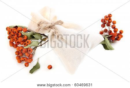 Textile sachet pouch with dried berries isolated on white
