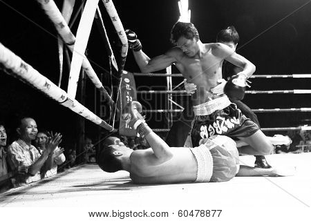 CHANG, THAILAND - FEB 22, 2013: Unidentified Muaythai fighter in ring during match (black and white series). For many Thai men, Muaythai only way to break out of poverty, per battle pay to 7000 baht.