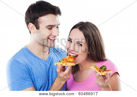 Young couple eating pizza 