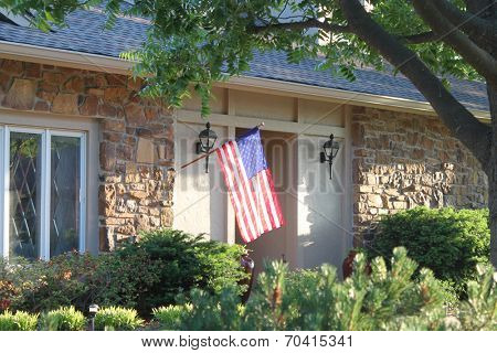 A nice house with a large American flag