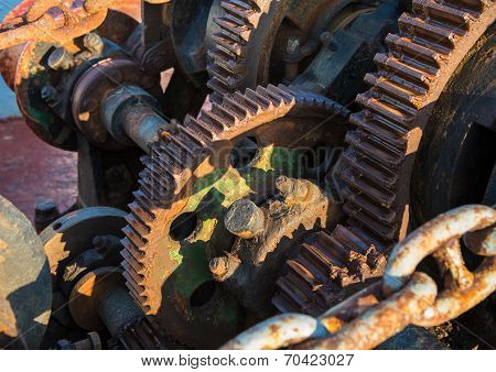Aged Technology: Old And Rusty Gearwheel On An Old Ship - Retro And Vintage Look.