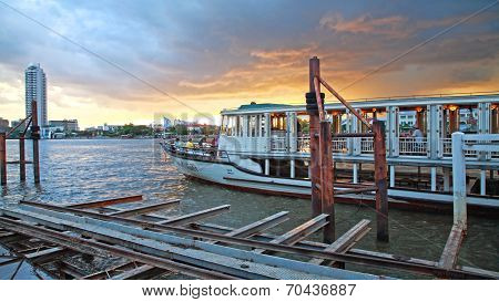 People Enjoy Dinner On Boat Tour