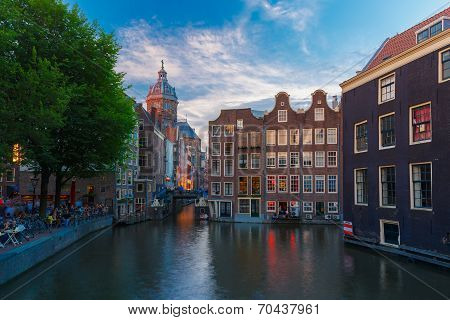 Night City View Of Amsterdam Canal, Church And Bridge