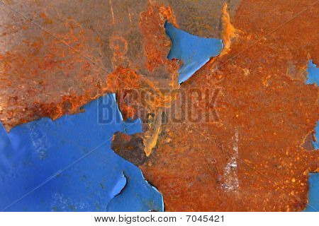 peeled blue paint on rust   grunge