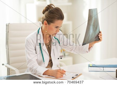 Doctor Woman Looking On Fluorography
