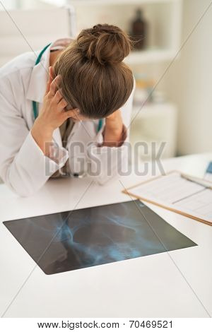 Stressed Doctor Woman With Fluorography