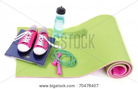 Sport requisites on a carpet isolated on white